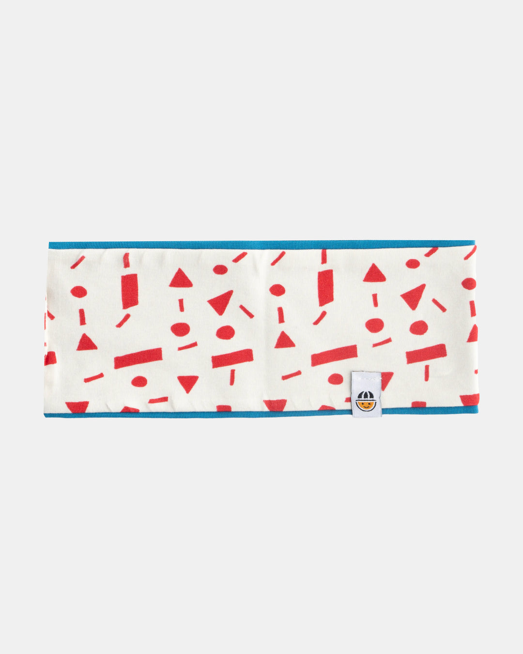 Reversible organic cotton headband from the Breeze collection in red pattern and blue, flat lay front view